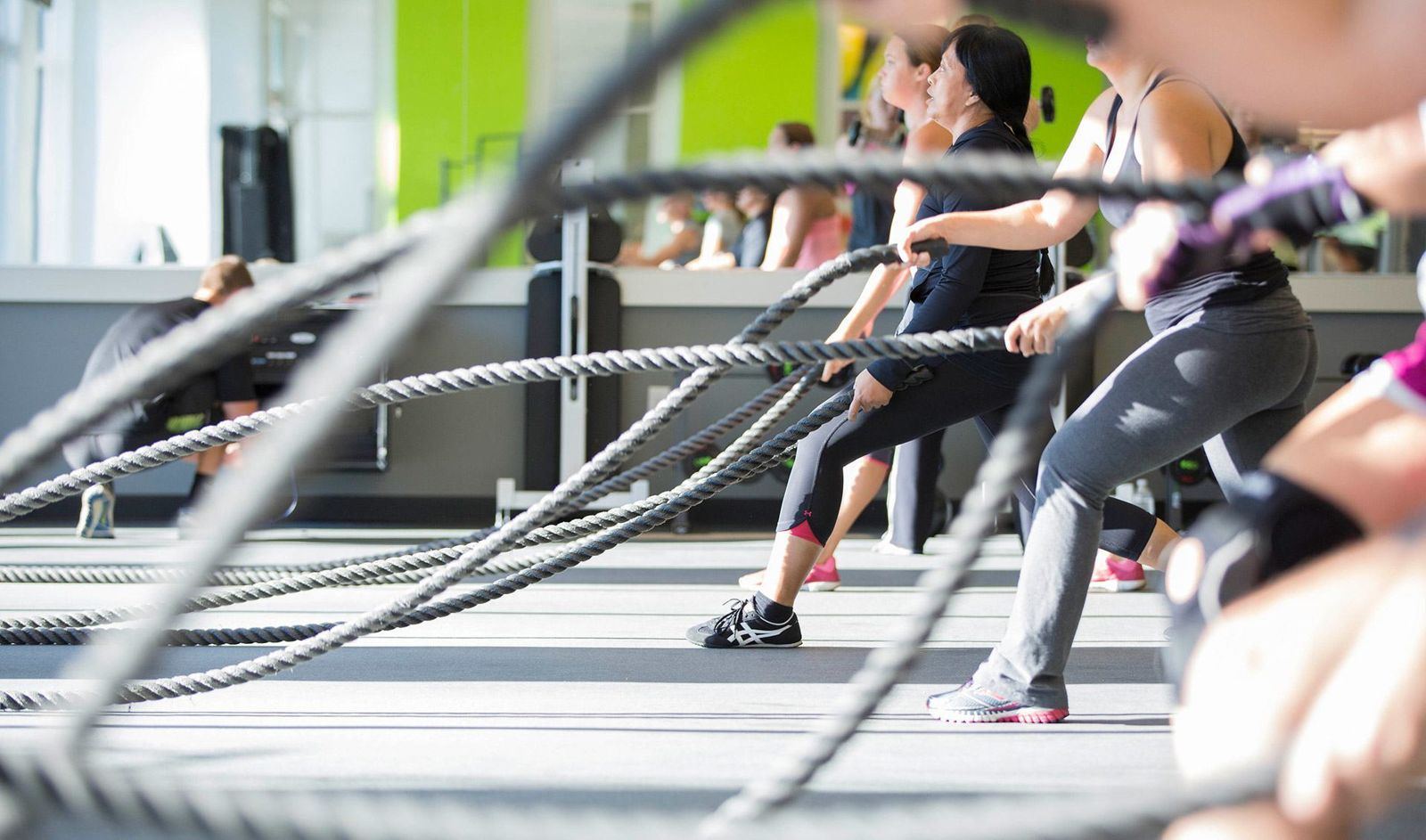 Members training with battle ropes