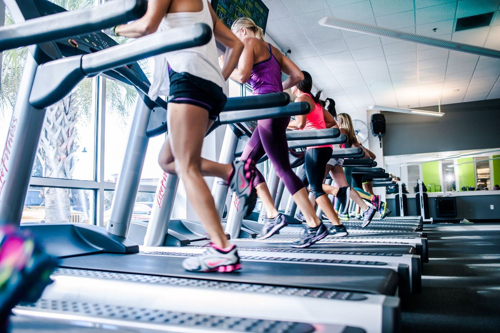 Group training class on the treadmill floor